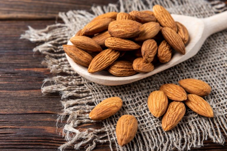 fresh almonds wooden table